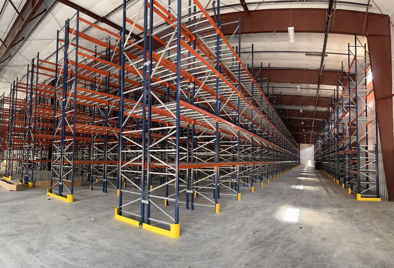 Panoramic view of completed selective pallet racking with pick levels across the new facility